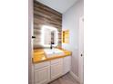Updated bathroom featuring custom wood counter and wall accents, white vanity and square sink at 5250 S Rainbow Blvd # 2033, Las Vegas, NV 89118