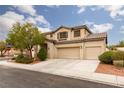 Charming two-story home featuring a well-maintained lawn and a two-car garage at 5609 Hannah Gordon Ct, North Las Vegas, NV 89081
