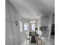 Dining room features a chandelier, a large storage closet, and marble floors at 60 E Levi Ave, Las Vegas, NV 89183