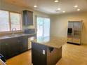 Well-equipped kitchen with a large island, stainless steel appliances, and granite countertops at 9746 Brooks Lake Ave, Las Vegas, NV 89148