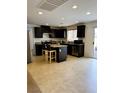 Charming kitchen featuring stainless steel appliances, granite countertops, and a center island at 9746 Brooks Lake Ave, Las Vegas, NV 89148