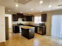 Modern kitchen with stainless appliances, granite counters, and ample storage space at 9746 Brooks Lake Ave, Las Vegas, NV 89148