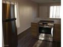 Modern kitchen featuring stainless steel appliances and granite countertops at 3946 Voxna St, Las Vegas, NV 89119