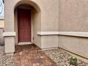 Close-up of the front entrance with a brick walkway and desert landscaping at 4520 Lemon Gems Ct, Las Vegas, NV 89130