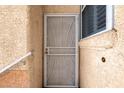 Close-up of an exterior door with a decorative security screen at 5000 Red Rock St # 241, Las Vegas, NV 89118