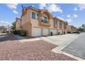 Charming townhome with private balconies, attached garages, and low maintenance desert landscaping at 5000 Red Rock St # 241, Las Vegas, NV 89118