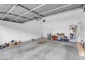 Spacious garage with a roll-up door, offering ample storage and parking space at 5000 Red Rock St # 241, Las Vegas, NV 89118