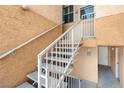 Outdoor staircase leading to an upper-level condo unit at 5000 Red Rock St # 241, Las Vegas, NV 89118