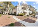 Well-maintained multi-Gathering home boasts manicured landscaping, enhancing curb appeal and creating a welcoming atmosphere at 5211 Caspian Springs Dr # 201, Las Vegas, NV 89120