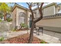 Cozy courtyard with seating area and decorative landscaping at 6 Desert Dawn Ln, Henderson, NV 89074