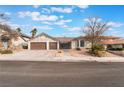 Charming single-story home with a two-car garage and well-maintained landscaping at 6320 Vicuna Dr, Las Vegas, NV 89146
