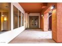 Well-lit common hallway with neutral tones and access to different units in the condo complex at 19 E Agate Ave # 402, Las Vegas, NV 89123