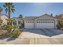 Lovely single-story home featuring a spacious three-car garage and a well-maintained front yard at 2012 Lady Lake St, Las Vegas, NV 89128