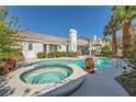 Inviting backyard with a sparkling pool and jacuzzi, perfect for relaxation and entertainment at 2012 Lady Lake St, Las Vegas, NV 89128