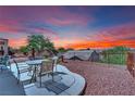 Lovely backyard with a desert landscape and wrought-iron furniture at 2077 Wildwood Lake St, Henderson, NV 89052