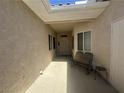 Welcoming courtyard with a skylight, a bench and tiled flooring provides a private outdoor space at 2270 Canyon Song Ave, Laughlin, NV 89029