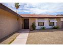 Inviting front entrance with stone landscaping and desert-friendly plants at 325 Greenfield Ln, Las Vegas, NV 89107