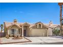 Charming single-story home with a well-maintained lawn and desert landscaping in a sunny neighborhood at 3700 Hedge Grove Dr, North Las Vegas, NV 89032