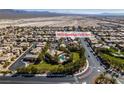 Enjoy this aerial view of the home in a community with well-maintained landscaping, parks, and community pool at 3829 Hawkeye Falls Ave, North Las Vegas, NV 89085