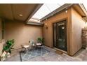 Private outdoor patio with pavers, outdoor lighting, sitting area and access to the house at 3829 Hawkeye Falls Ave, North Las Vegas, NV 89085