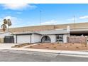 Attractive home with a two-car garage and a low-maintenance garden, creating a welcoming facade at 3911 Chutney St, Las Vegas, NV 89121