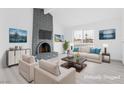 Bright living room features a grey brick fireplace and modern decor at 3911 Chutney St, Las Vegas, NV 89121