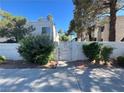 Gated entrance with mature landscaping and access to Park West Condominiums at 5117 Eldora Ave # 4, Las Vegas, NV 89146