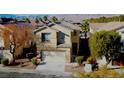 Charming two-story home with a well-maintained front yard and an attached two-car garage at 5309 Luna Bonita St, Las Vegas, NV 89113