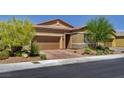 Charming single-story home featuring desert landscaping, a two-car garage, and a brick-paved driveway at 5518 Taylor Rose Ave, Las Vegas, NV 89139