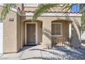 Welcoming front porch featuring a security screen door and quaint architectural details at 5854 Heather Marie Dr, Las Vegas, NV 89110