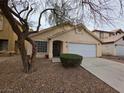 Attractive single-story home featuring a two-car garage and a tidy front yard, perfect for suburban living at 7209 London Bridge Ave, Las Vegas, NV 89130