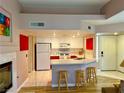 Bright kitchen features white cabinets, modern appliances, and a convenient breakfast bar for casual dining at 7400 W Flamingo Rd # 2058, Las Vegas, NV 89147