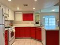 Updated kitchen featuring white cabinets, quartz countertops, and stainless steel appliances at 7400 W Flamingo Rd # 2058, Las Vegas, NV 89147