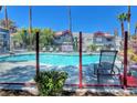 Relaxing community pool area with lounge chairs and lush landscaping at 8600 W Charleston Blvd # 2089, Las Vegas, NV 89117