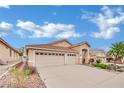 Well-maintained home with a three-car garage, neutral exterior, and desert landscaping at 8624 Burning Hide Ave, Las Vegas, NV 89143