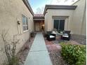 Inviting front patio with outdoor seating on a peaceful walkway at 9449 Grand Mesa Dr, Las Vegas, NV 89134