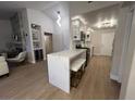 Bright kitchen with modern white cabinetry, quartz countertops, and stainless steel appliances at 9449 Grand Mesa Dr, Las Vegas, NV 89134