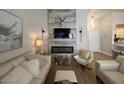 Stylish living room features modern fireplace and comfortable seating at 9449 Grand Mesa Dr, Las Vegas, NV 89134