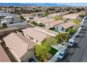 Aerial view highlighting the community layout, featuring multiple homes, well-maintained landscaping, and convenient street access at 11007 Vallerosa St, Las Vegas, NV 89141