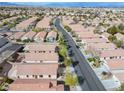 Expansive aerial view of a well-planned community with numerous single-story homes, showcasing a peaceful neighborhood setting at 11007 Vallerosa St, Las Vegas, NV 89141