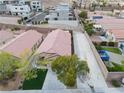 Aerial view of a single-story home with a spacious driveway and a low-maintenance backyard, offering privacy and convenience at 11007 Vallerosa St, Las Vegas, NV 89141