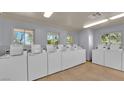 Bright laundry room with multiple washing machines for the convenience of residents at 1455 E Katie Ave # 16, Las Vegas, NV 89119