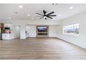 Open living room with a large media center, linear fireplace, recessed lights, and a bright window at 1891 Brian Rd, Pahrump, NV 89048