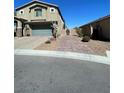 Two story home with a landscaped front yard and an attached two car garage at 22 Kaku Ridge Way, Las Vegas, NV 89183