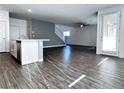 Open living room with new floors and modern finishes at 290 Mount Williamson St, Henderson, NV 89015