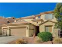Charming two-story home featuring a three-car garage and xeriscaping at 317 Shimmering Moon St, Henderson, NV 89015