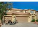 Charming two-story home featuring a three-car garage and well-maintained landscaping at 317 Shimmering Moon St, Henderson, NV 89015