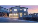 Charming two-story home featuring a three-car garage and stone accents, set on a well-manicured lot at 522 Riley Ridge Ct, Henderson, NV 89012