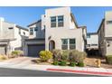 Contemporary two-story home with desert landscaping and a tile roof at 524 Grand Cascade Pl, North Las Vegas, NV 89084
