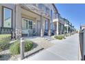 Desirable neighborhood featuring a row of townhouses with charming front porches at 6434 Spring Jog St, Las Vegas, NV 89166